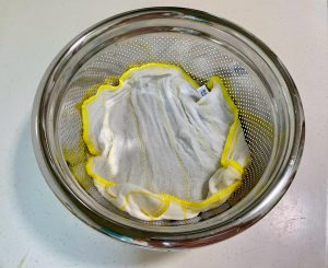 Cover: Take a second wet cloth and place it directly on top of the beans.