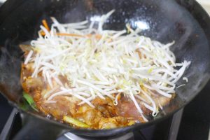 Add Crunch Toss in the mung bean sprouts. Stir-fry on high heat for just 1 minute. You want them to heat through but remain crunchy.