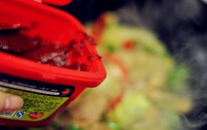 Create the Sauce Pour in a small amount of water (about 1/4 cup). This is crucial—it turns the thick Gochujang paste into a glossy sauce that can coat every ingredient.
