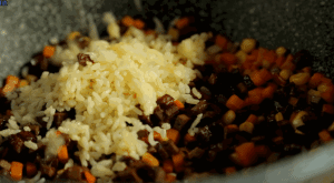 Combine & Season: Add the "Golden Rice" back into the wok. Toss everything together.