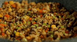 Finish: Toss well to distribute the color and flavor evenly. Turn off the heat. Stir in the chopped scallions. The residual heat will release their aroma without wilting them too much.