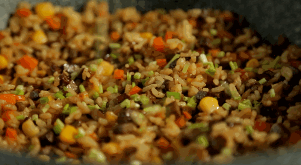 Finish: Toss well to distribute the color and flavor evenly. Turn off the heat. Stir in the chopped scallions. The residual heat will release their aroma without wilting them too much.