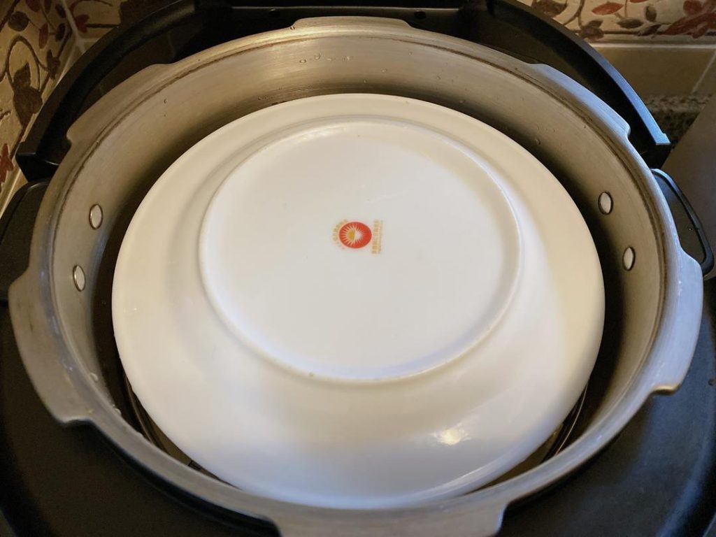 Cover the bowl with a plate or a tight layer of foil (to prevent condensation from watering down the sauce). Steam over boiling water for 1 hour