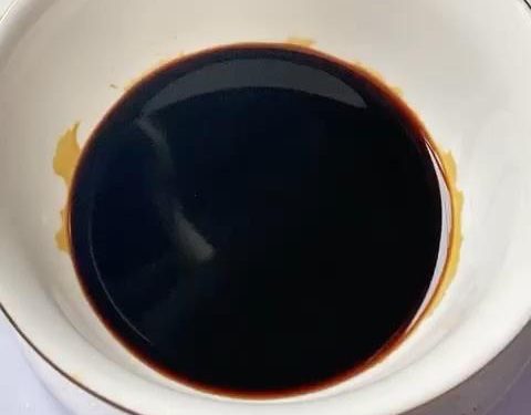 Rub the 2 tbsp of dark soy sauce all over the pork. Place it skin-side down in a shallow dish with the leftover dark soy sauce to soak for 10 minutes. Remove and dry the skin completely.