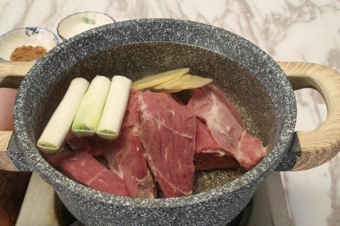 Stew the Meat Place the meat in a pot with cold water to cover.