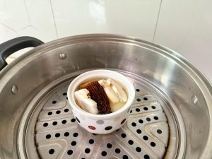 The "Wet" Steam Uncover the steamer carefully (watch out for hot steam!). Pour boiling water into each bowl, filling it mostly to the top. Add your mushrooms (Morels or Shiitakes) and a pinch of salt to each bowl.