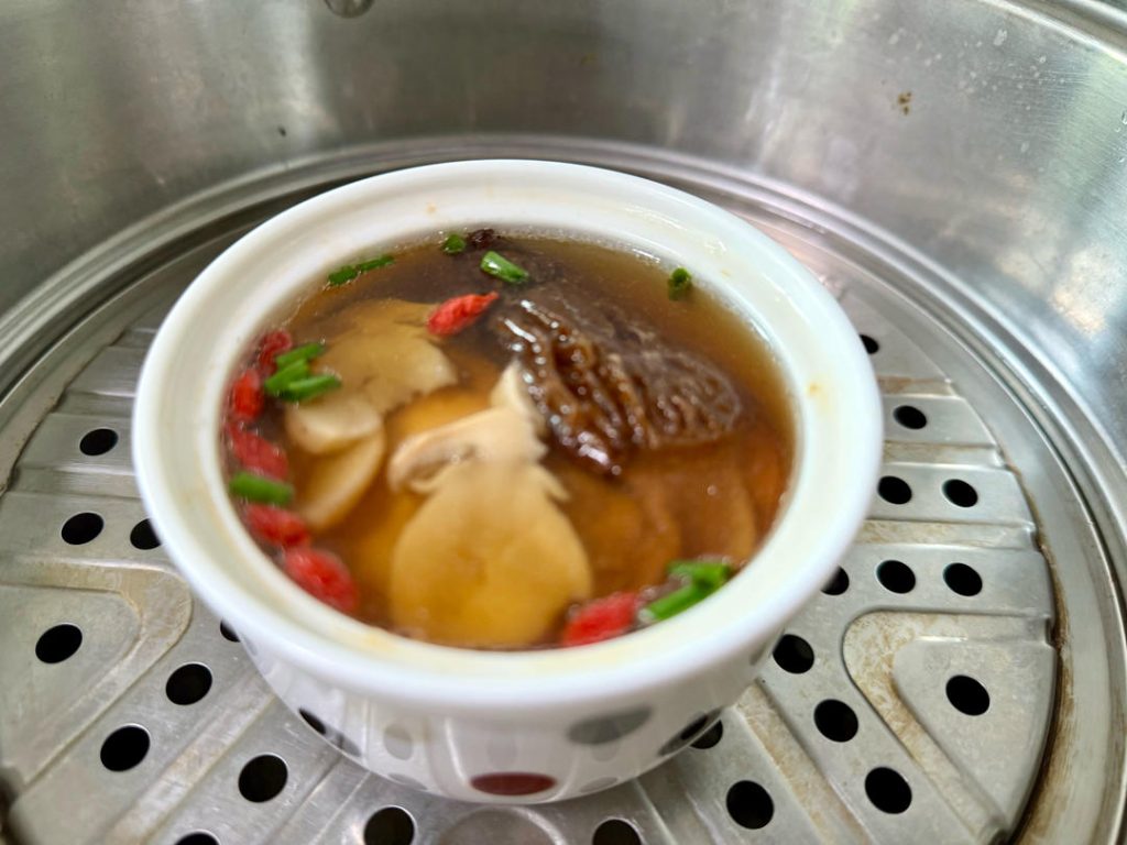 Final Simmer
Cover and steam for another 30 minutes. The long steam allows the mushroom flavors to permeate the broth and the pork to release its savory juices.