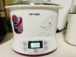 Stew for 1 Hour: Let the congee simmer gently for exactly 1 hour. Stir occasionally to prevent the rice from sticking to the bottom. Visual cue: The congee is done when the rice grains have burst open and the liquid is thick and creamy. The pork should easily pull away from the bone.