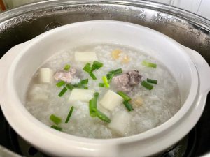 Season and Serve: Turn off the heat. Stir in salt to taste. Ladle the hot congee into bowls and garnish generously with chopped scallions.