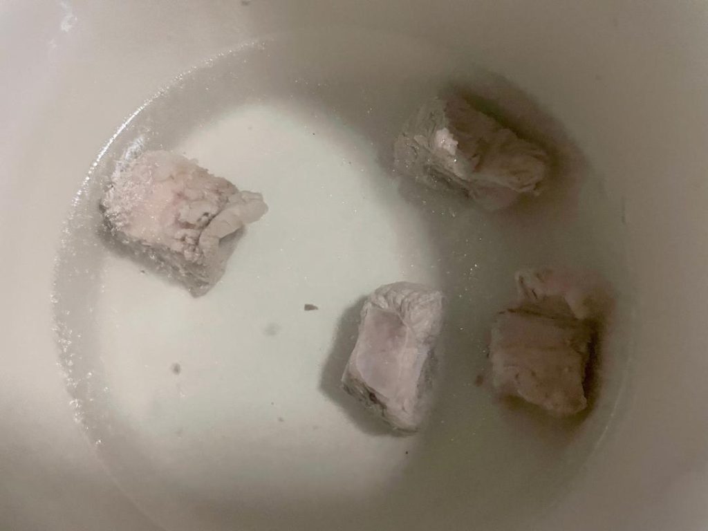 Rinse and Repeat: Carefully pour out the dirty water. Pour a second batch of freshly boiled water over the ribs and stir again. Pour this water out.