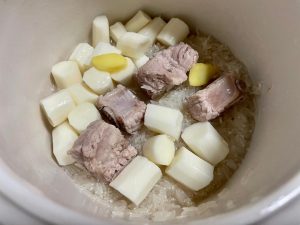 Combine Ingredients: To the pot with the clean ribs, add your peeled yam segments, the rinsed white rice, and the 2-3 slices of fresh ginger.