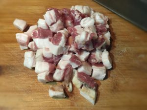 Prep the Meat: Wash the pork belly. Remove the skin (save it for stock if you like). Dice the meat into small cubes (about the size of a fingernail).