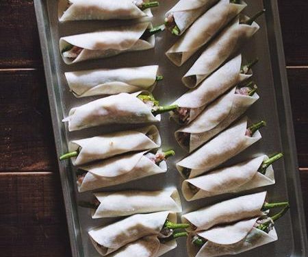 Wrap the Dumplings Take a round dumpling wrapper. Moisten the edges with a little water. Wrap the dough around the middle section of the stuffed pepper (like a belt or a blanket). Press the seam tightly to seal. The tip and the stem of the pepper should still be visible.