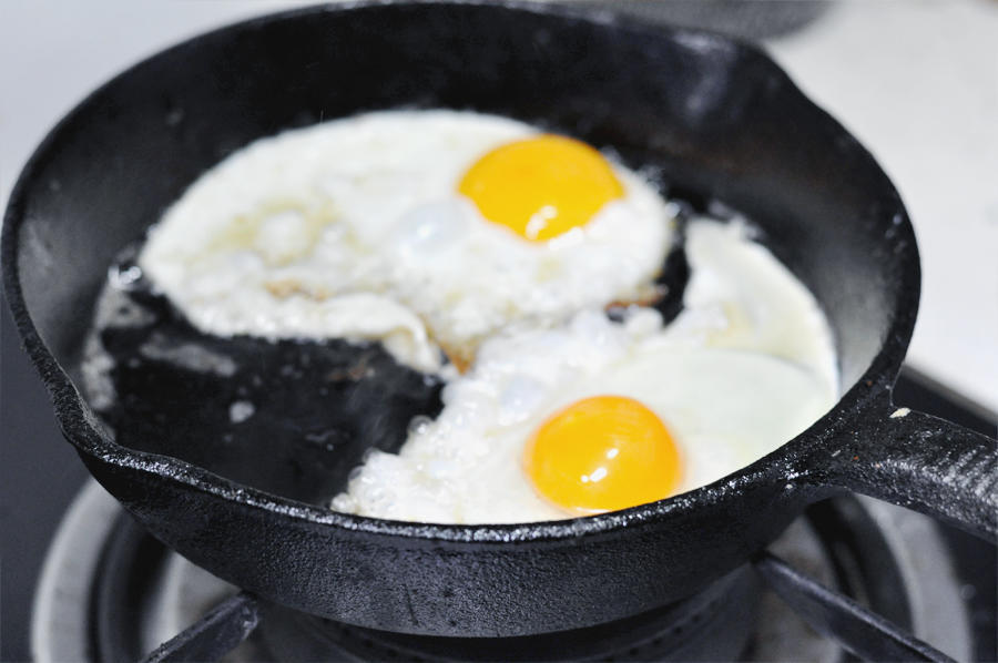 The Crown Jewel (Fried Egg) In the same pan (wipe it out if needed), fry two eggs. Cook them to your preference, but I highly recommend "Sunnyside Up" or "Over Easy" (about 60% cooked) so the yolk remains runny.