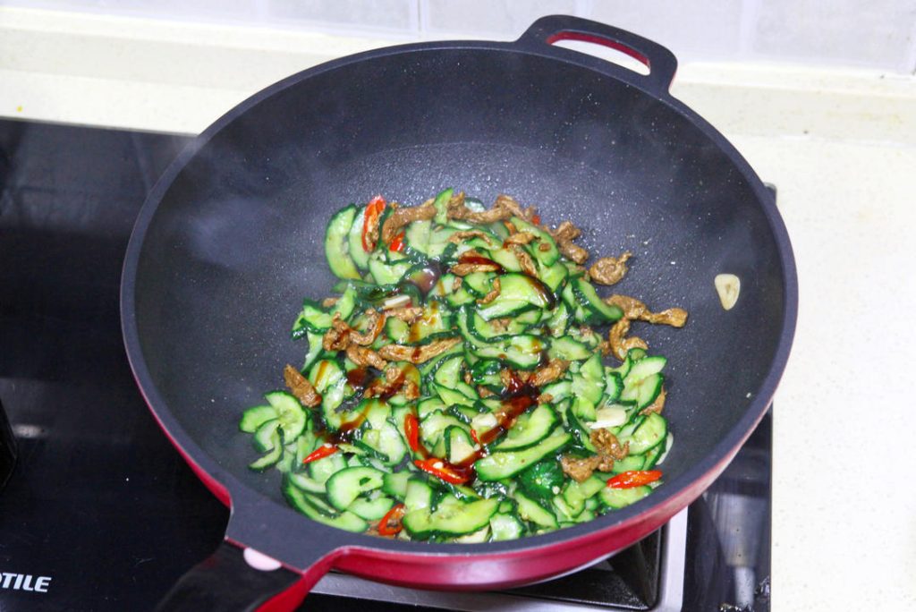 Final Toss Return the pork to the wok.