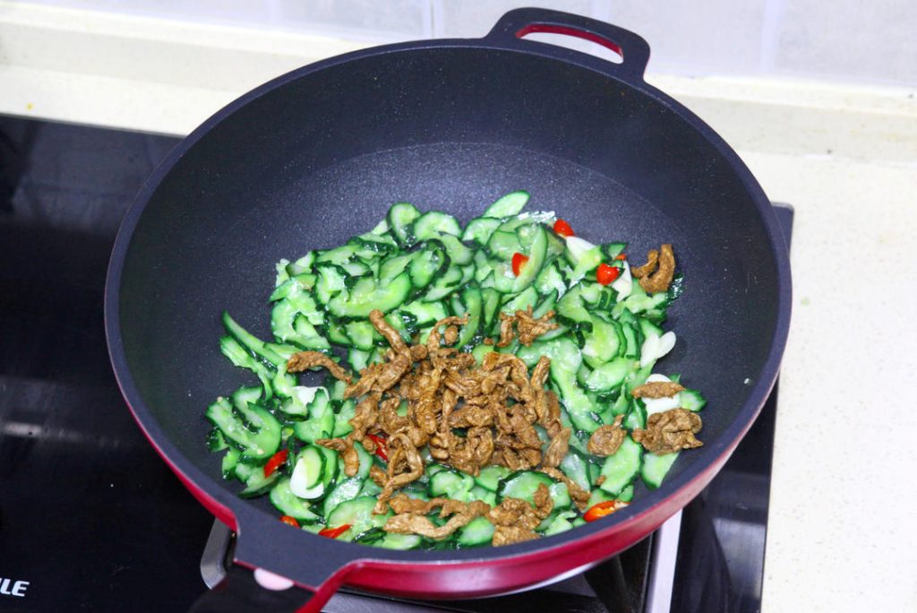 Final Toss Return the pork to the wok.