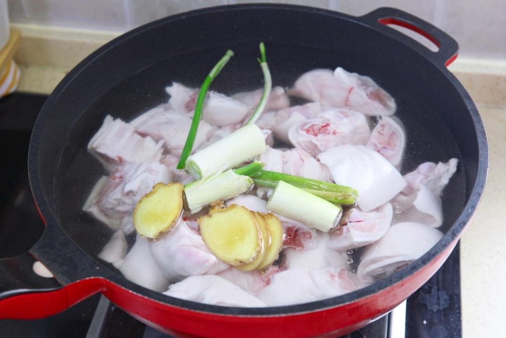 Rinse the chopped trotters thoroughly. Place them in a large bowl of cold water and soak for 30 minutes. This draws out blood and impurities, which is vital for a clean-tasting sauce.