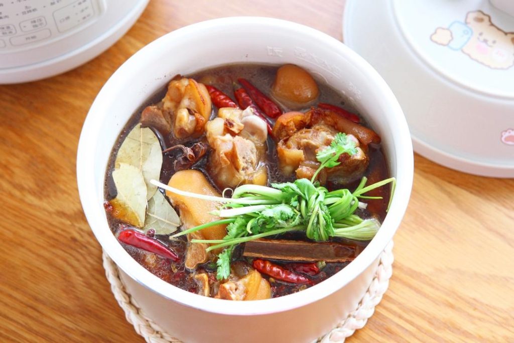 Transfer everything from the wok into your electric pressure cooker (Instant Pot). Add the scallion knot, cilantro, bay leaves, and the optional peanuts.