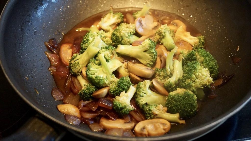 Step 6: Make the Sauce
Add the remaining 1 tablespoon of hoisin sauce, 1/2 tablespoon of Light Soy Sauce, and 1 tablespoon of sugar to the pan. Add a splash of water. Bring to a boil over high heat and let it reduce slightly until it forms a sticky glaze.