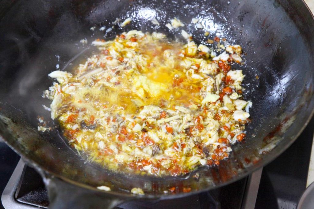 Season and Finish Pour the Shaoxing wine around the perimeter of the wok (this helps the alcohol evaporate quickly, leaving the aroma). Stir in the ginger puree. Finally, season with salt and white pepper. Stir for 30 more seconds to combine.