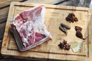 Combine Ingredients: Place the soaked pork belly chunks into your pressure cooker. Add the spice bag, salt, Dark Soy Sauce, Light Soy Sauce, and rock sugar.