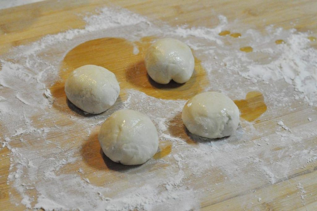 First Rise: Cover the dough and let it ferment in a warm place for 1 hour, or until it has slightly expanded (it won't double like soft bread dough).