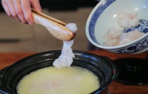 Add the Fish Once the millet is fully cooked and the porridge is creamy, turn the heat down to low.