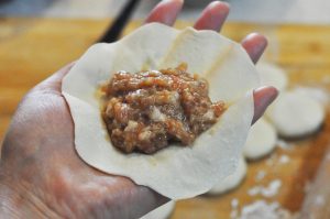 Wrap: Place a spoonful of the meat/jelly mixture in the center. Pleat the edges together and seal the top tightly.