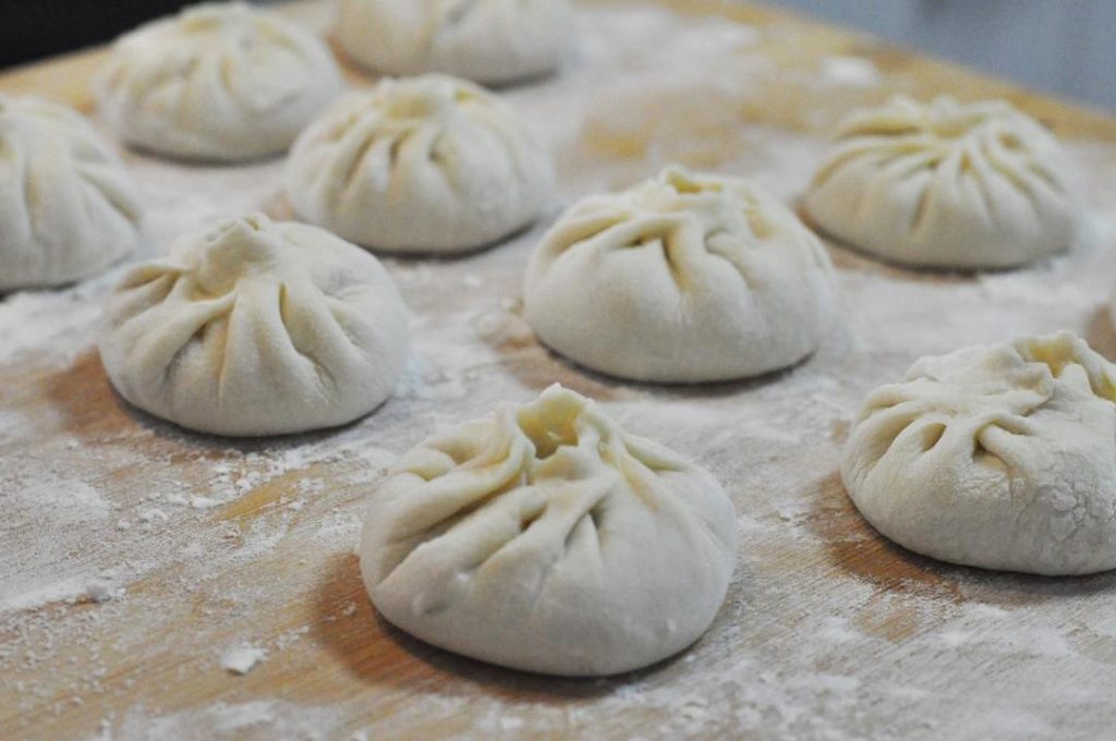 Rest: Place the buns on a board and let them relax for 5 minutes.