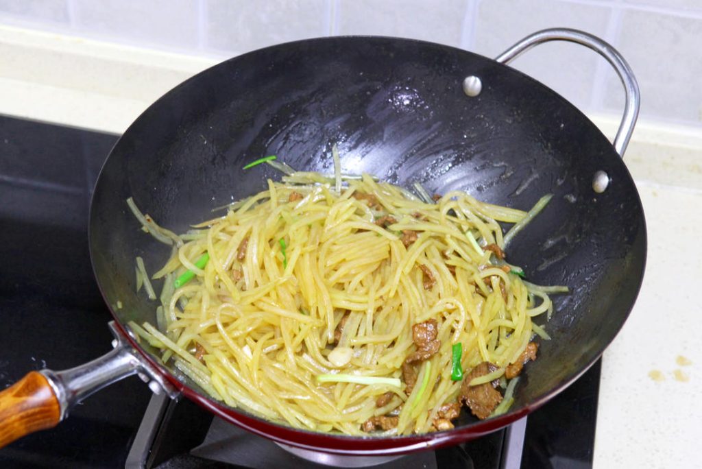 Continue to stir-fry for another 30-60 seconds to let the flavors meld. Add the scallion sections and give it a final toss (about 10 seconds) just to wilt the greens. Serve immediately with steamed rice.