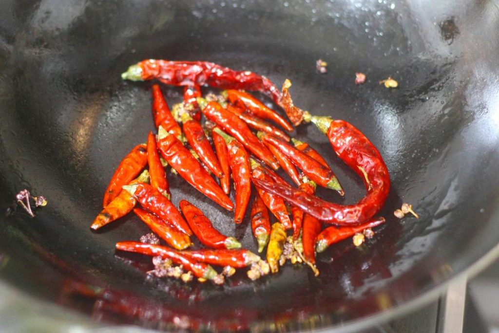 Ventilation: Toasting chilies and the final oil splash create smoke and spice fumes. Turn your exhaust fan to high!