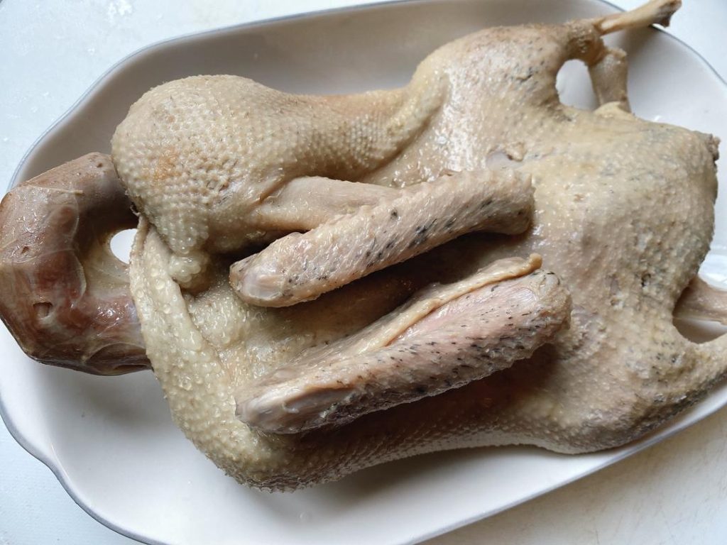 Chop and Serve: Remove the duck from the ice bath and pat dry. Chop into bite-sized pieces, arrange on a platter, and drizzle with a few spoons of the hot braising liquid.