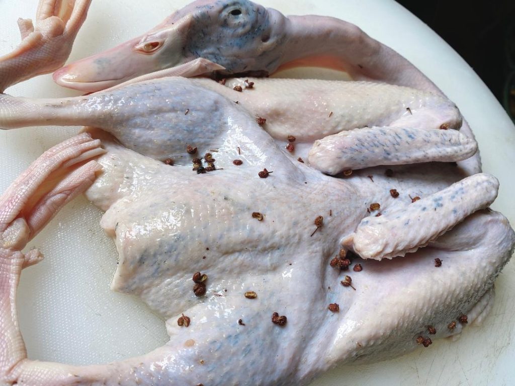 Marinate: Rub the toasted peppercorn-salt mixture evenly over the entire surface of the duck, ensuring you get inside the cavity as well. Cover tightly with plastic wrap and refrigerate for at least 2 hours (overnight is highly recommended).