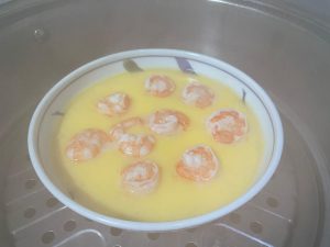 The Second Steam: Cover the pot again and continue steaming over medium-high heat for another 4 to 5 minutes. The dish is done when the shrimp turn completely opaque and pink, and the egg is fully set.