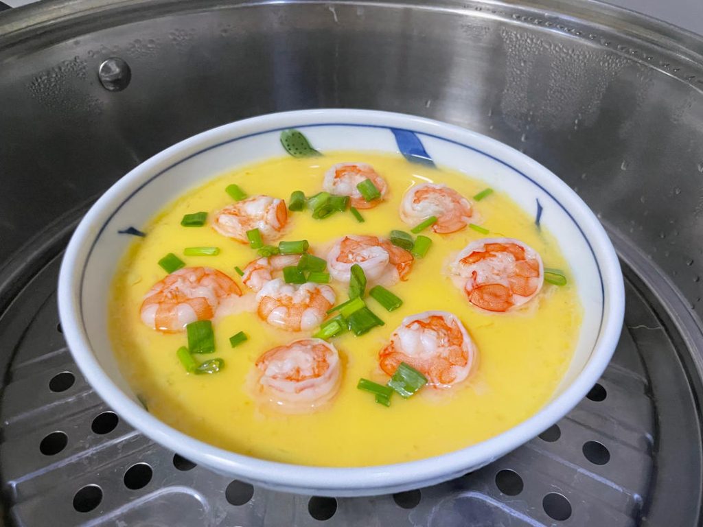 The Second Steam: Cover the pot again and continue steaming over medium-high heat for another 4 to 5 minutes. The dish is done when the shrimp turn completely opaque and pink, and the egg is fully set.