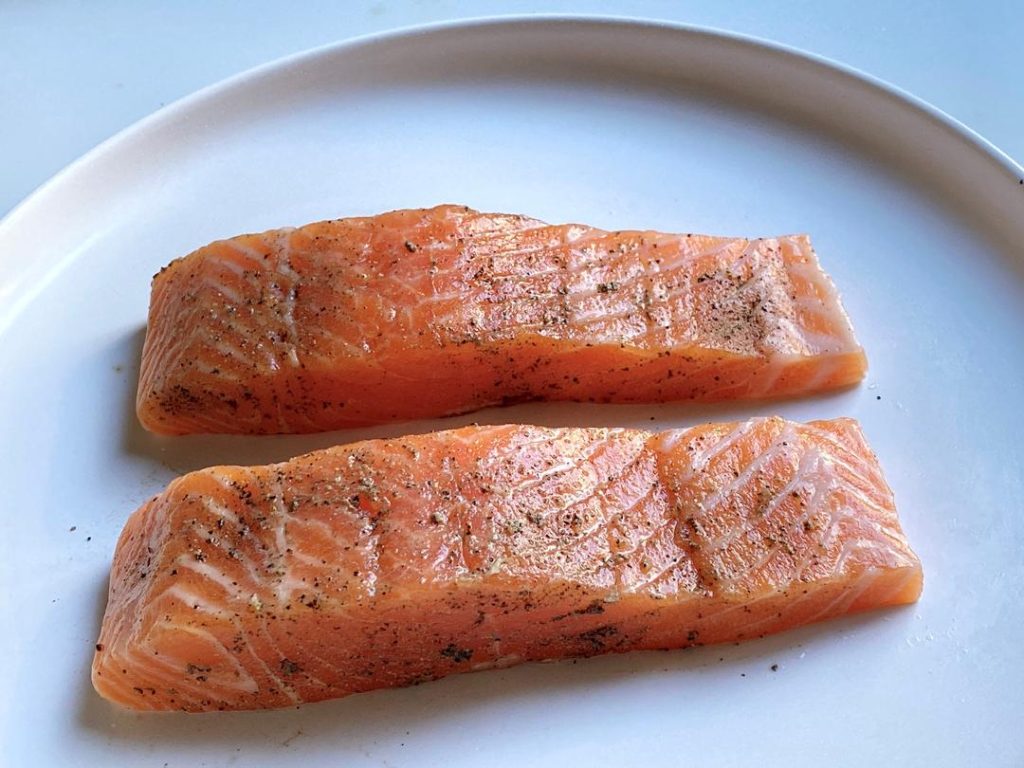 Season and Marinate (15 mins): Place the salmon strips on a plate. Sprinkle evenly with sea salt and black pepper. Squeeze fresh lemon juice over the top. Let it sit at room temperature for exactly 15 minutes.