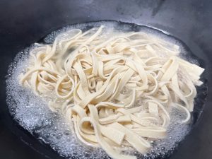 Bring a pot of water to a boil. Add the sliced tofu skin strips.