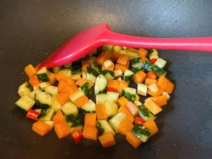 Add the Cucumber: Toss in the diced cucumber. Stir-fry briskly for only 30 seconds.