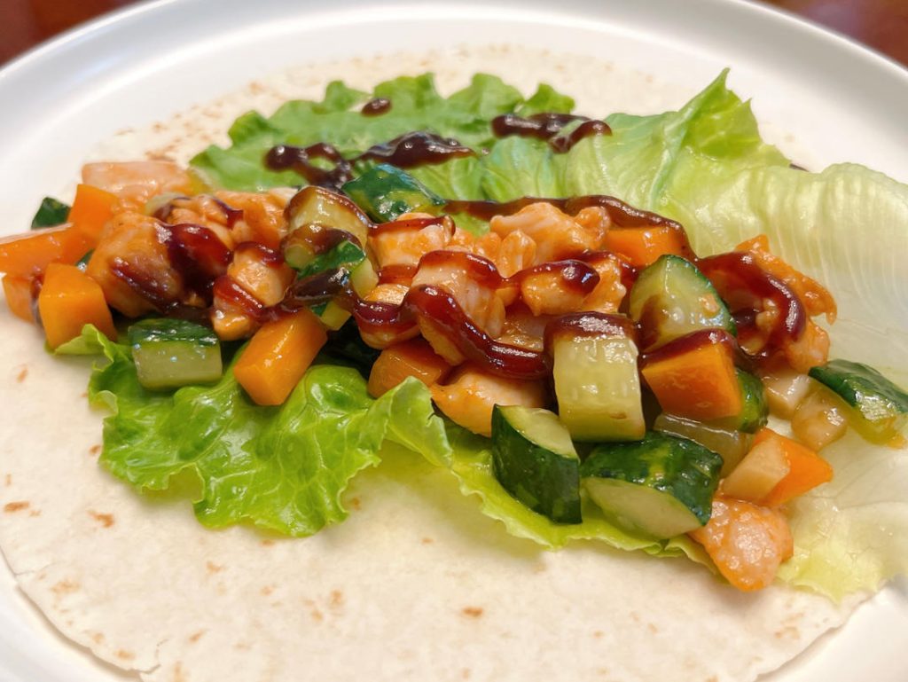 Assemble the Wraps: Lay a flour tortilla flat. Place a lettuce leaf in the center. Spoon a generous amount of the chicken and vegetable mixture onto the lettuce. Squeeze your preferred BBQ sauce over the top, roll it up tightly, and serve immediately.