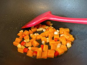 Cook the Carrots: Add the diced carrots. Because they are dense, stir-fry them for about 1-2 minutes until they just begin to soften.