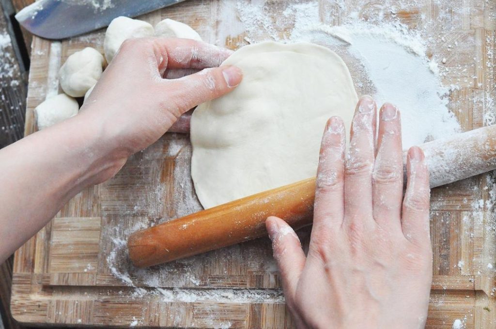 Roll the Pancakes Using a rolling pin, gently roll the stacked dough out. Rotate frequently to ensure a circle shape. Roll it until it is about 6-8 inches in diameter.