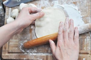 Roll the Pancakes Using a rolling pin, gently roll the stacked dough out. Rotate frequently to ensure a circle shape. Roll it until it is about 6-8 inches in diameter.