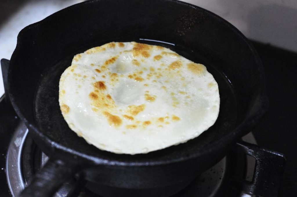 Pan-Fry Heat a non-stick pan over low-medium heat. Brush a tiny amount of oil on the pan (or use a dry pan if it's non-stick). Place the pancake in. Cook for about 45-60 seconds. You will see air pockets start to puff up in the middle—this is the steam separating the layers! Flip and cook the other side for another 30-45 seconds until slightly golden spots appear.