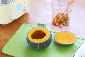 Prepare the Pumpkin Slice the top off the pumpkin (about 1/4 of the way down) to create a lid. Use a spoon to scrape out the seeds and fibrous innards.