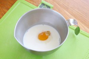 Prepare the Egg Liquid While the pumpkin steams, crack the egg into a bowl. Add the milk and the pinch of sea salt. Whisk thoroughly until well combined.