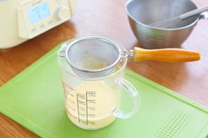 Strain the Mixture Pour the egg mixture through a fine-mesh sieve at least 2 to 3 times.
