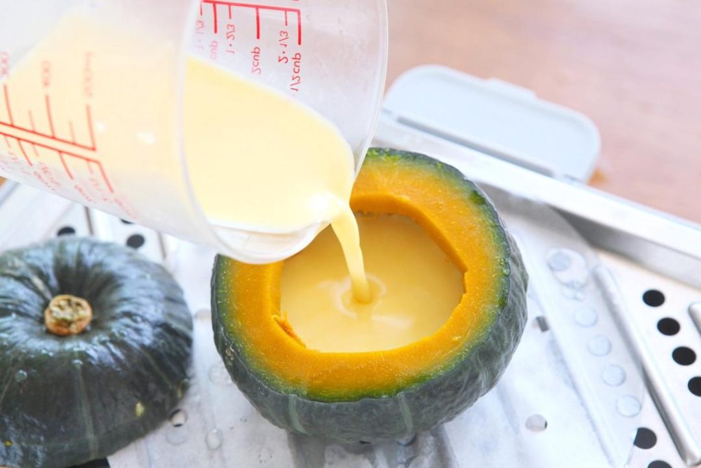 Fill and Steam Again Remove the pumpkin from the steamer (be careful, it will be hot). Pour the strained egg liquid into the pumpkin, filling it about 90% full.