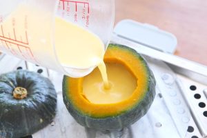 Fill and Steam Again Remove the pumpkin from the steamer (be careful, it will be hot). Pour the strained egg liquid into the pumpkin, filling it about 90% full.