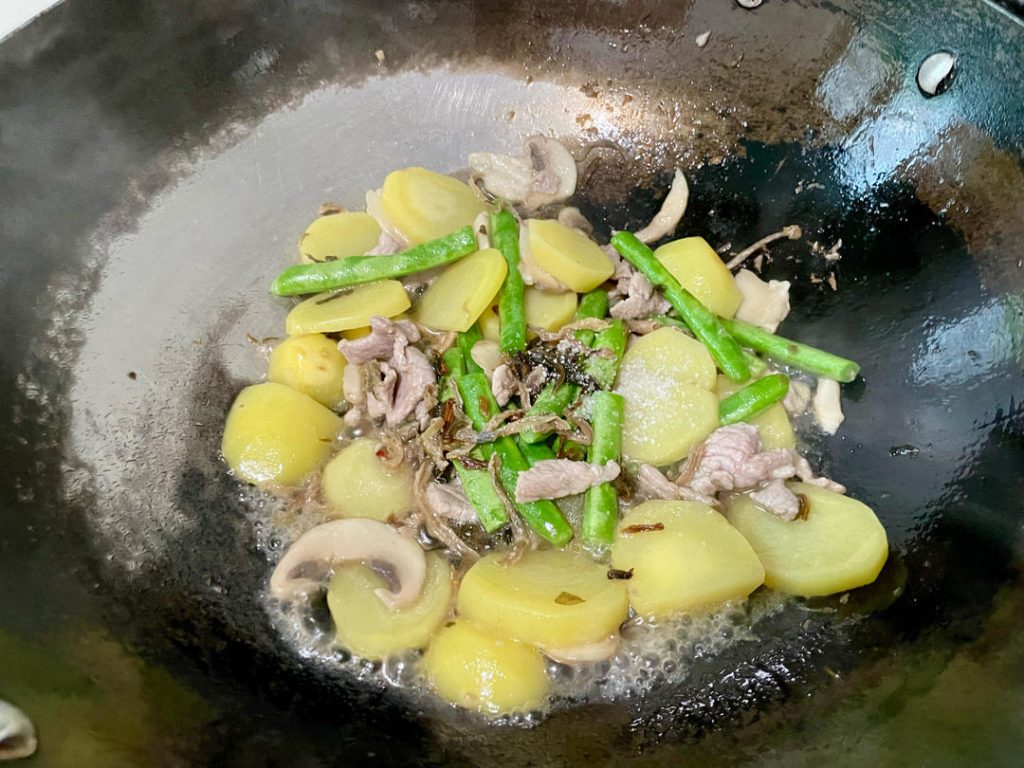 Add the Flavor: Toss in the dried bamboo shoots. Stir-fry for another 30 seconds to release their deep, earthy fragrance.