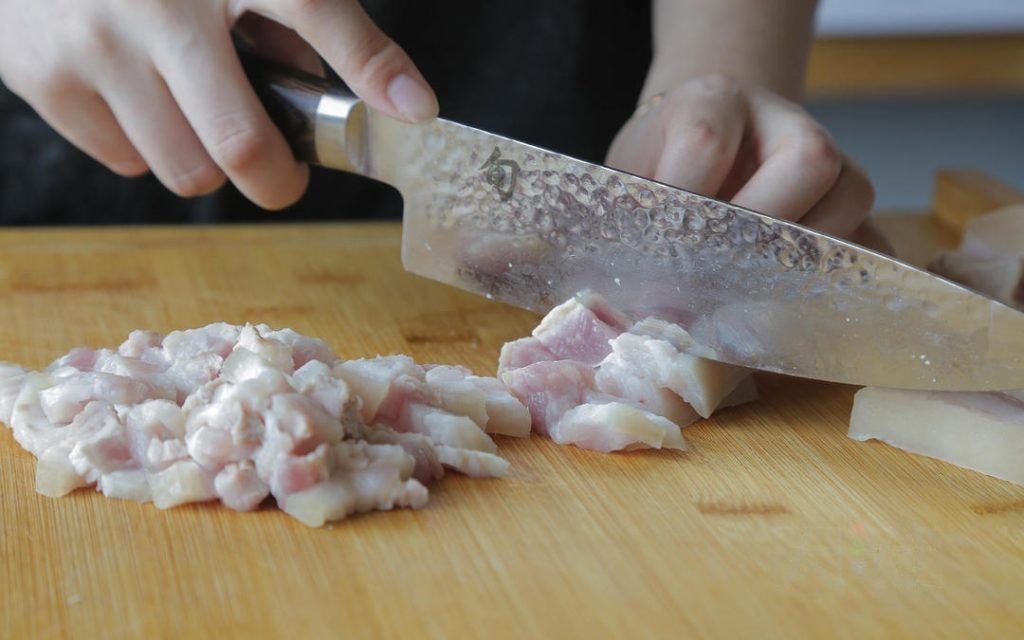Process the Pork Once the blanched pork has cooled down, slice it into thick slabs, and then cut those slabs vertically into strips (about 1cm or ½ inch thick).